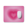Pink mouse pad with a heart design 